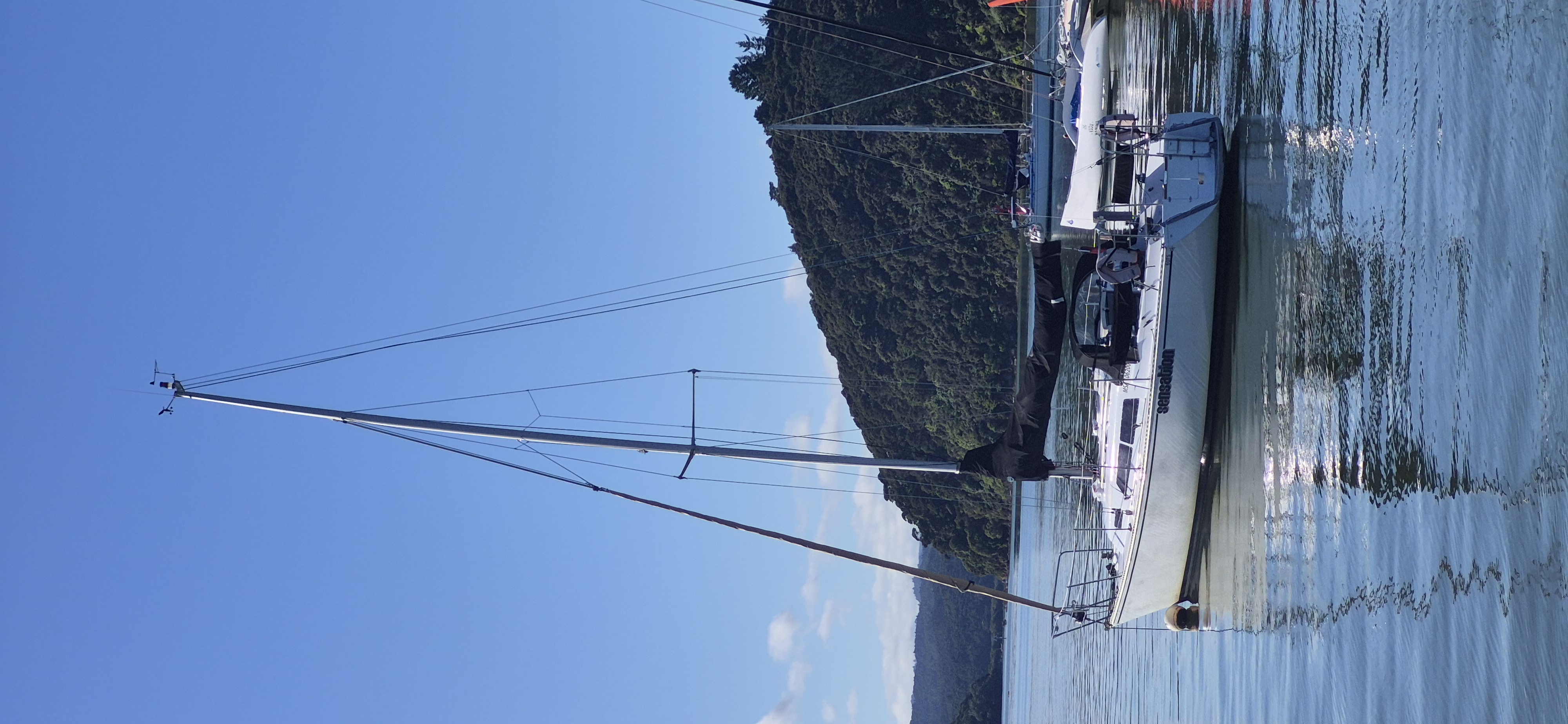 landscape a couple relaxing on the deck of a sailboat