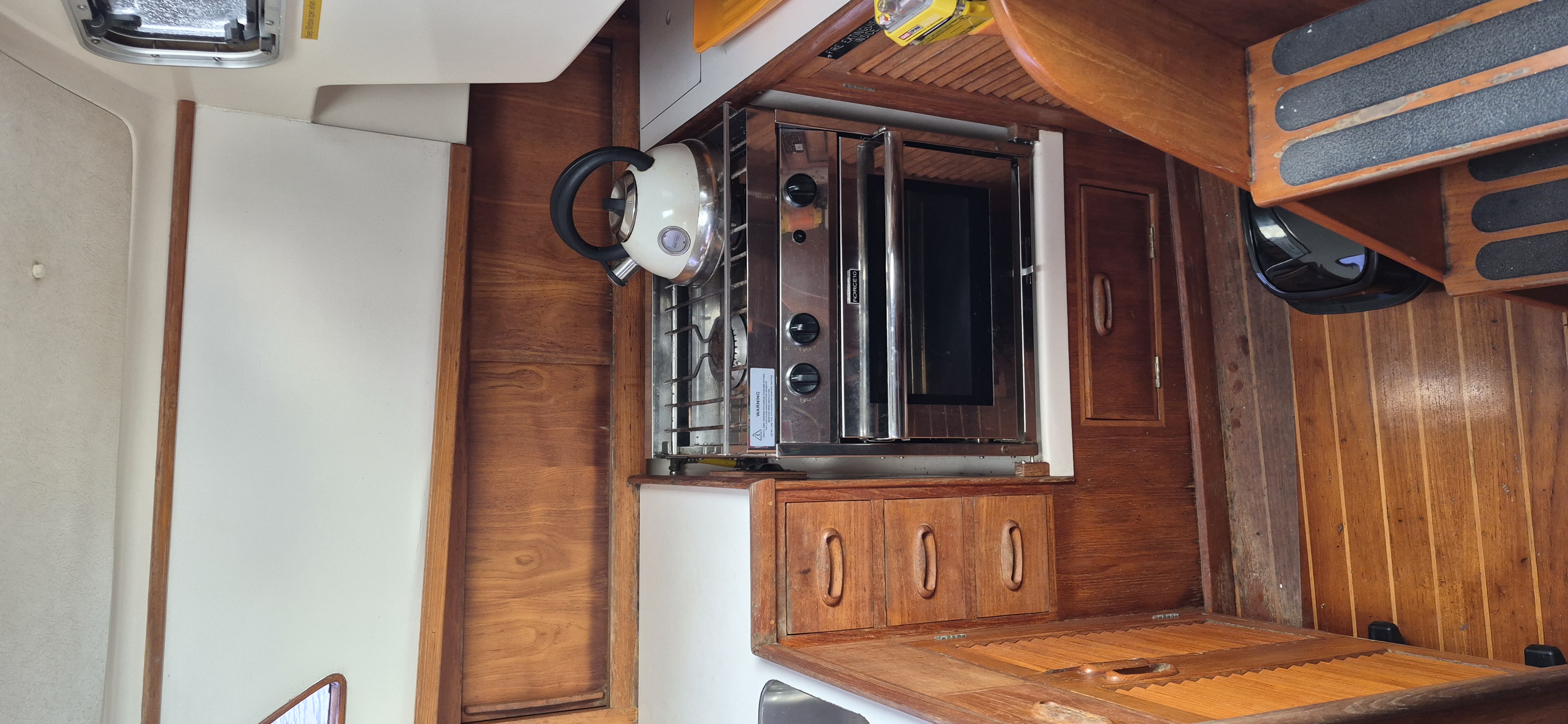 landscape a dolphin jumping out of the water near a boat